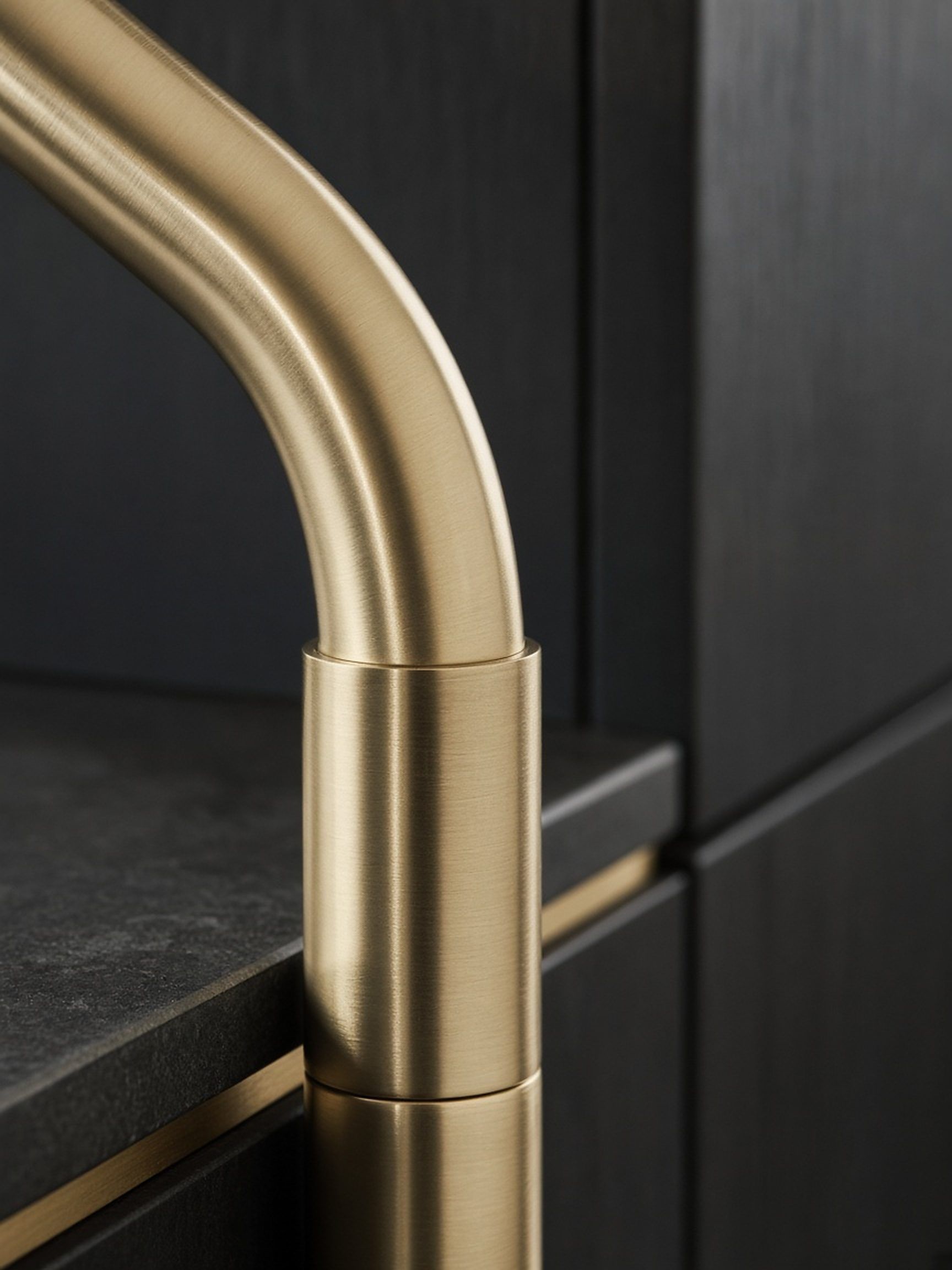 Close up of a brushed brass tap